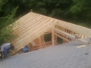 Framing a new roof addition that ties into an existing shingle roof in Verdi